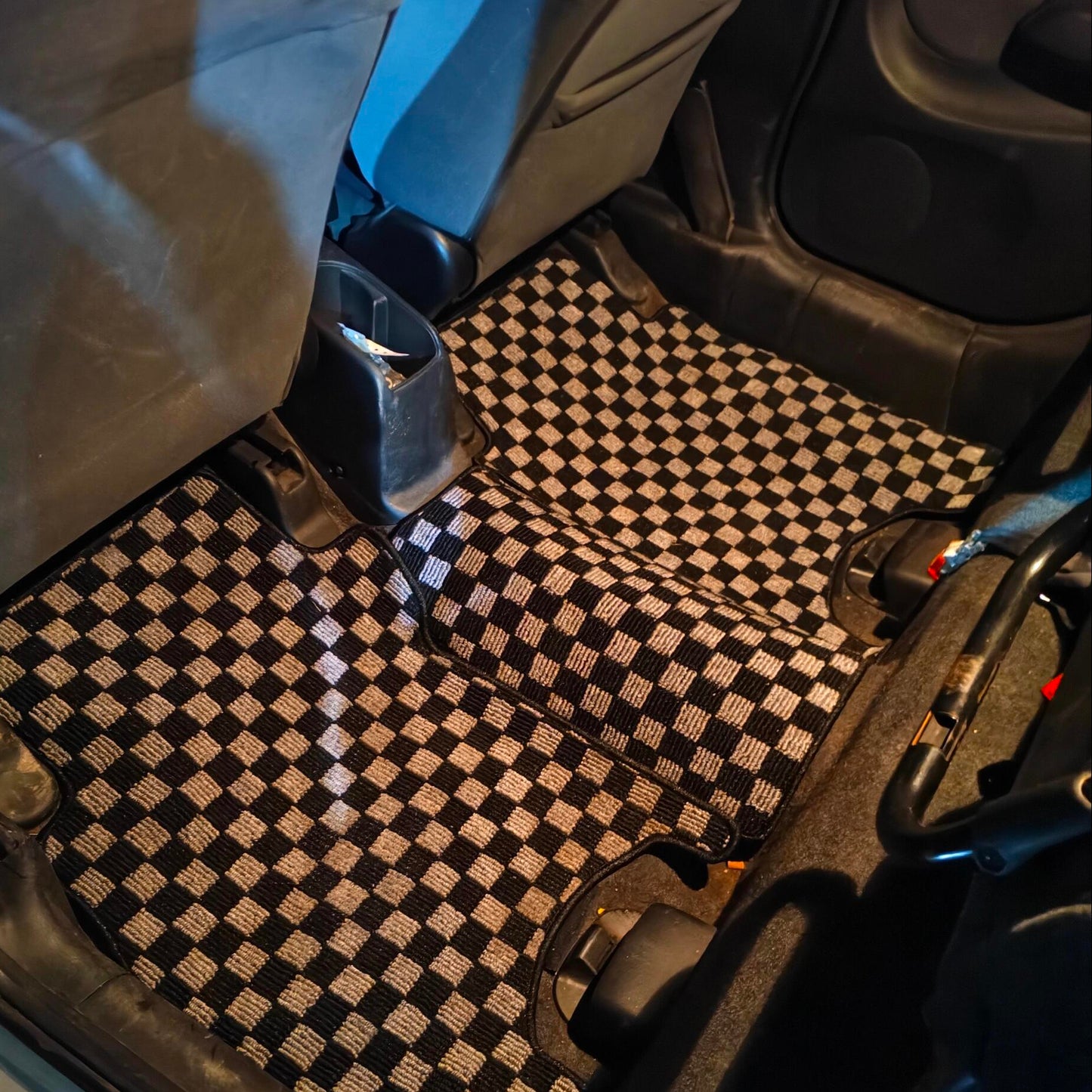 Checkered car floor mat in a vehicle JDM