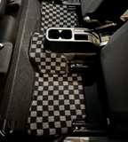 JDM Checkered car floor mats in a vehicle interior